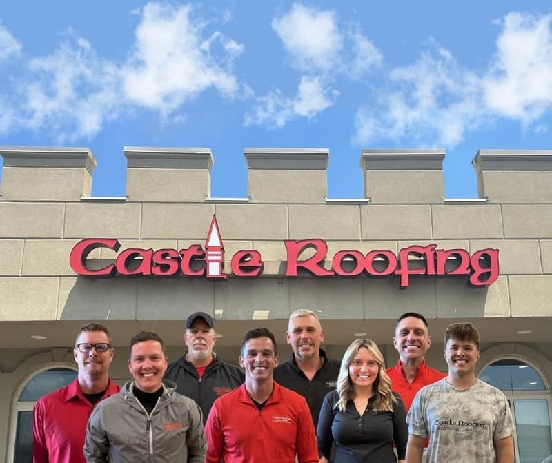 Castle Roofing team in front of office building